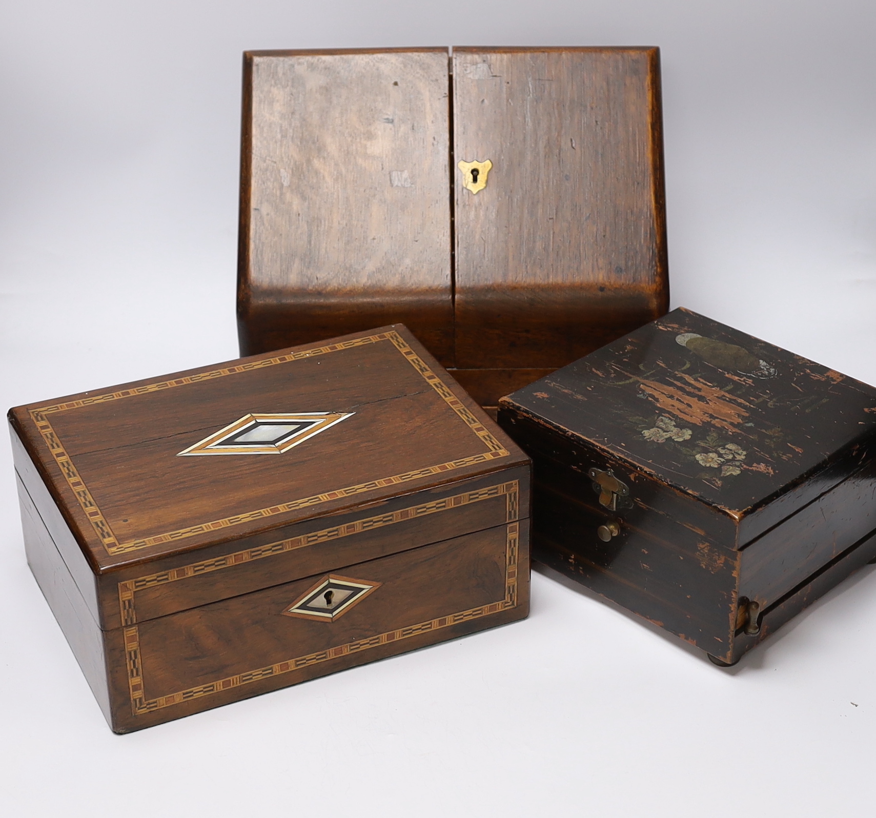 Three boxes; a miniature Polyphon, a stationery box and an inlaid jewellery box, stationery box 26cm high, 32cm wide